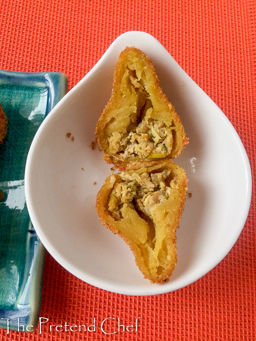 Crispy and elegant Coxinha, Brazilian chicken fritters sliced open