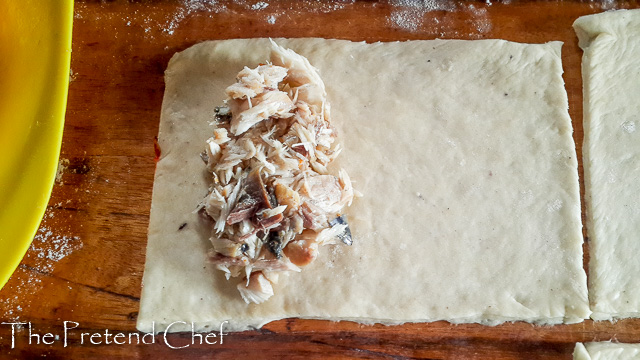 dough being filled for Nigerian fish pie