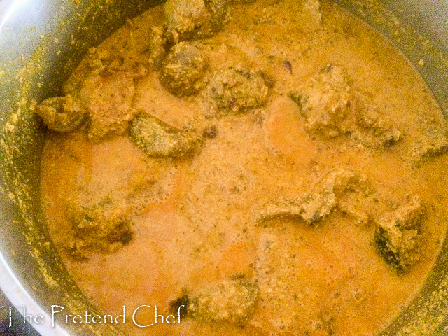 fried egusi soup boiling in a pot