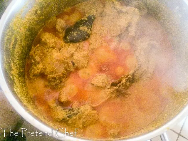 fried egusi soup boiling in a pot