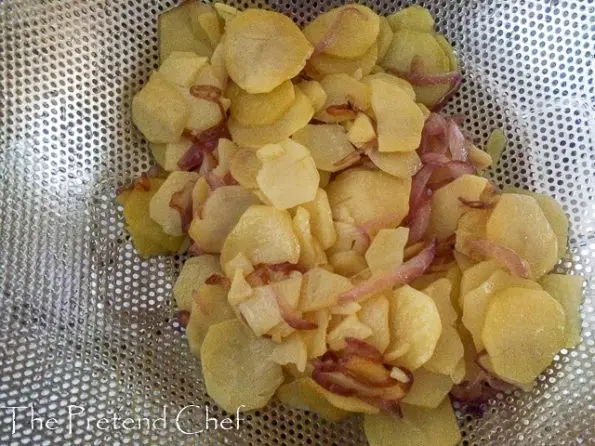 drained softened potatoes and onions draining sieve for easy spanish omelette