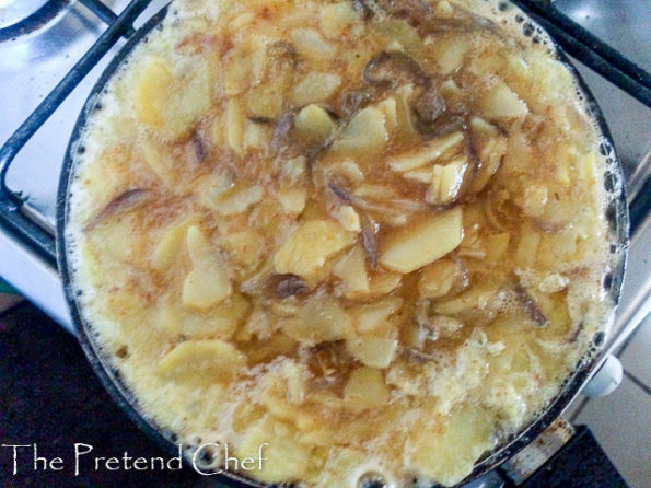 easy spanish omelette frying in pan