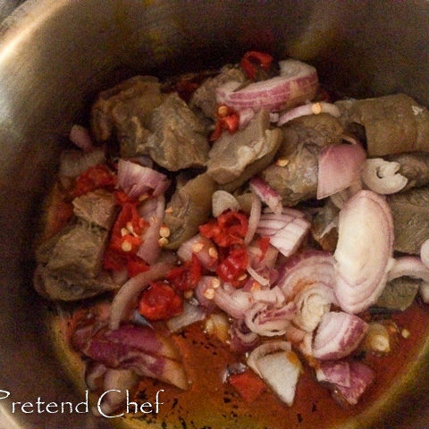 Bushmeat and vegetable cooking in a pot