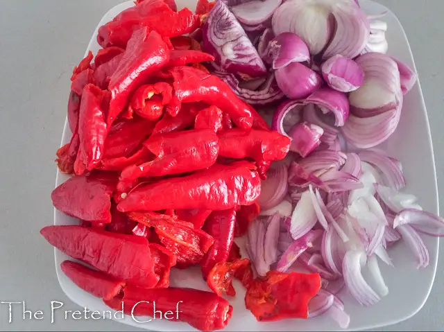 peppers and onions prepared for Spicy Cayenne Pepper Stew (Shombo Stew)
