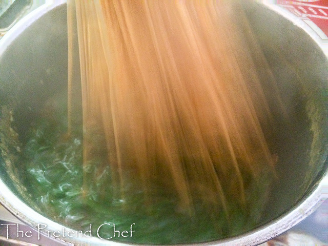 Mashing ewedu soup with ajabe