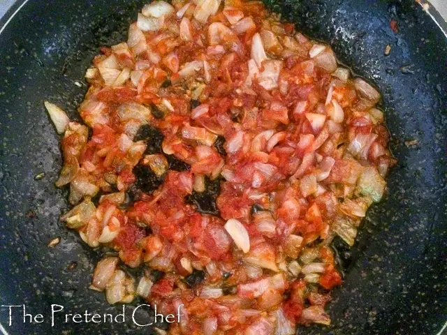 onions and tomato frying Nigerian Refried beans