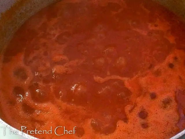 tomato/pepper mix boiling in a pot for Nigerian fish stew (Imoyo)