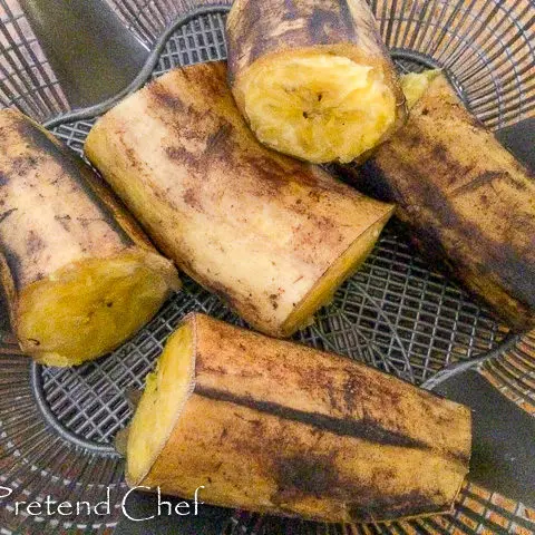 boiled plantains in a sieve for ripe plantain empanada