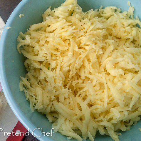 shredded cheese in bowl for pizza muffin