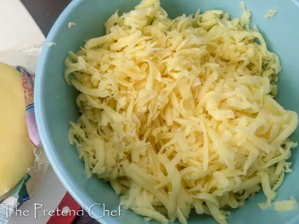 shredded cheese in bowl for pizza muffin