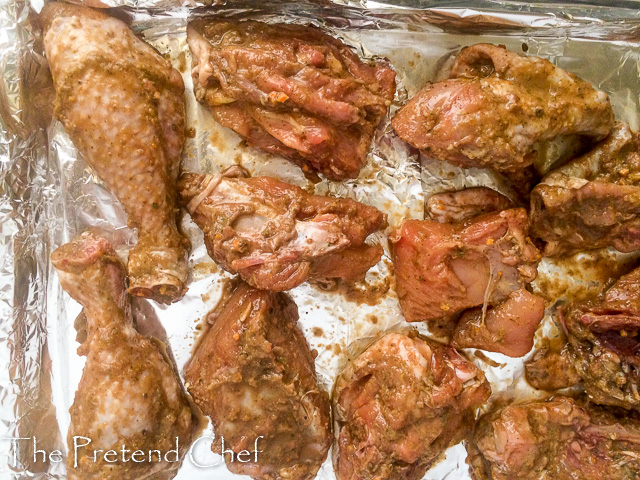 chicken marinated in jerk sauce ready for the oven