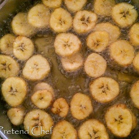 plantain discs frying in oil