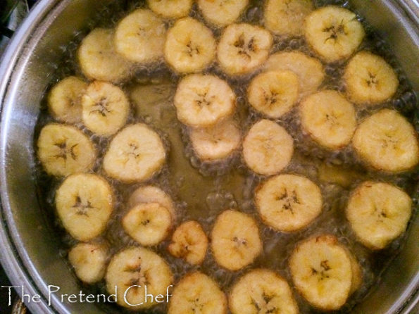 plantain discs frying in oil