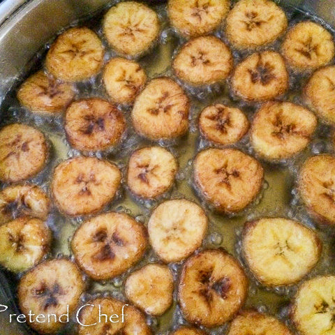 plantain discs frying in oil