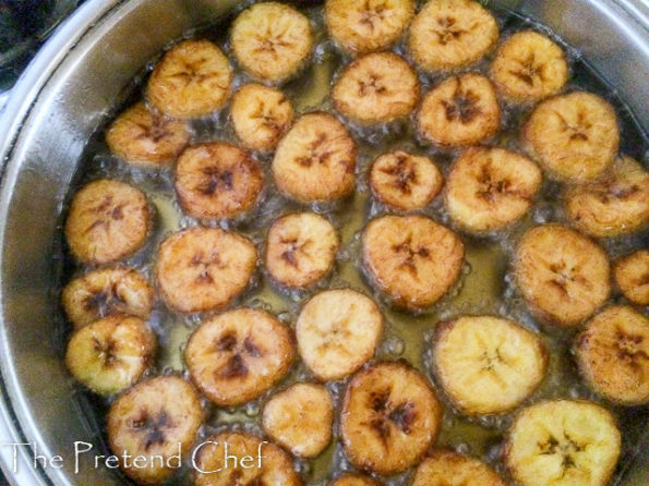 plantain discs frying in oil