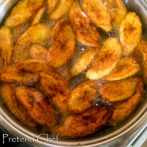 plantain slices frying in oil
