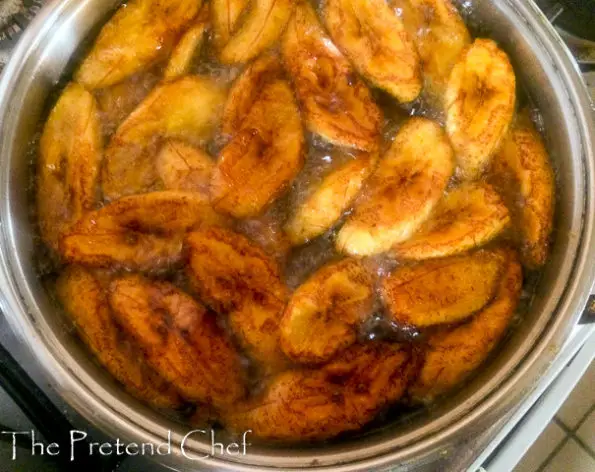 plantain slices frying in oil
