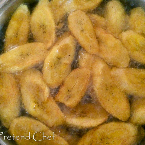 plantain slices frying in oil