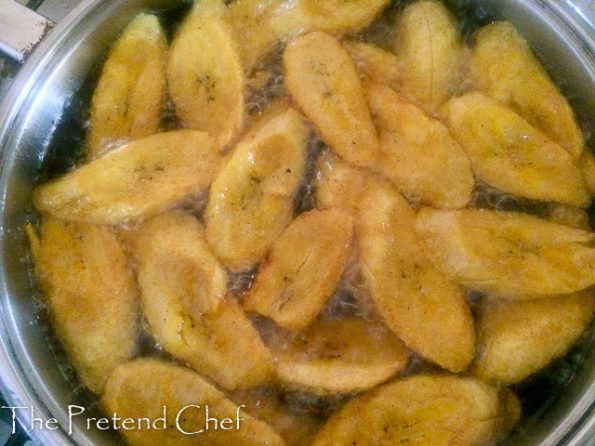 plantain slices frying in oil