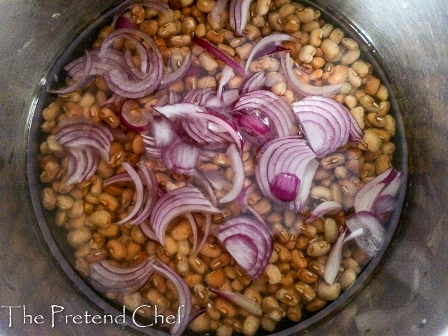 beans and onions in a pot