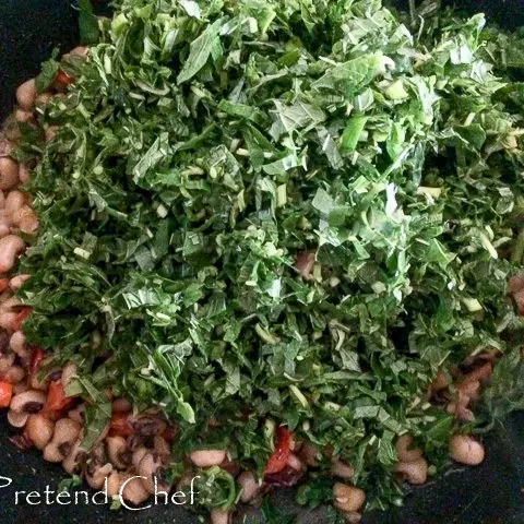 Nigerian Greens and beans cooking in a pot