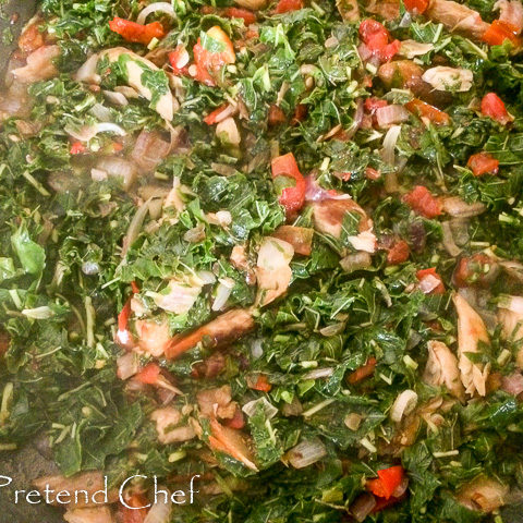 smoked fish with greens in a saucepan