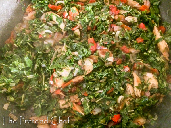 smoked fish with greens in a saucepan