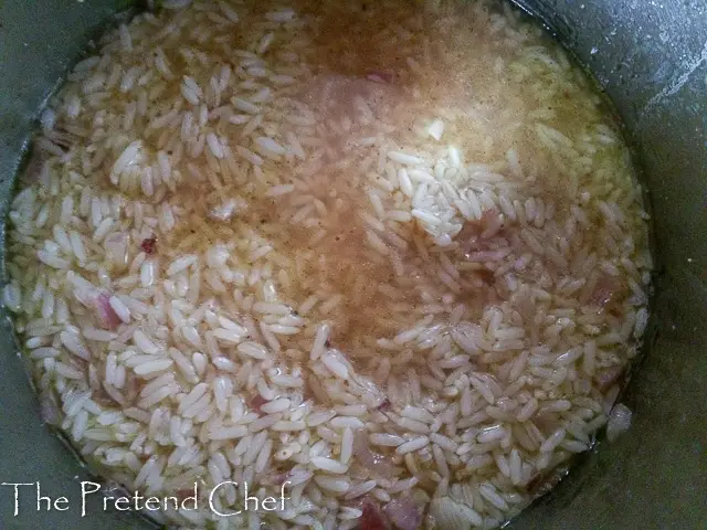 rice cooking in fish stock for Green leafy vegetable rice