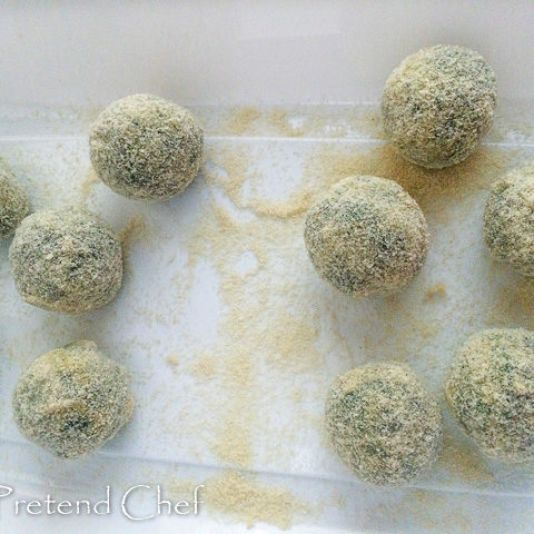 uncooked potato green vegetable balls coated in breadcrumbs and flour