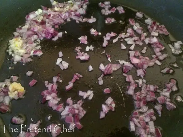 onions frying in a frying pan