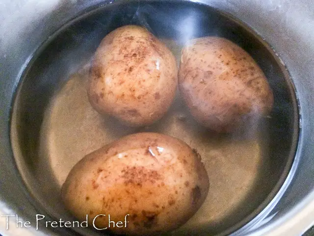 whole potatoes in a pot of water