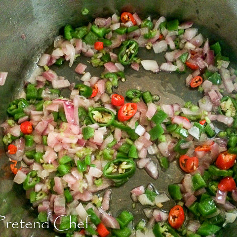 peppers frying for rich tomato gravy