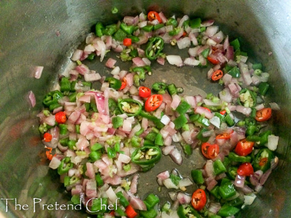 peppers frying for rich tomato gravy