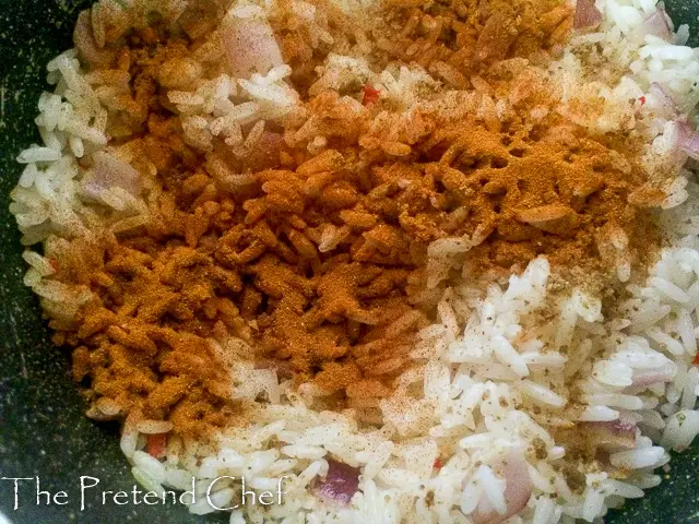turmeric sprinkled over parboiled rice
