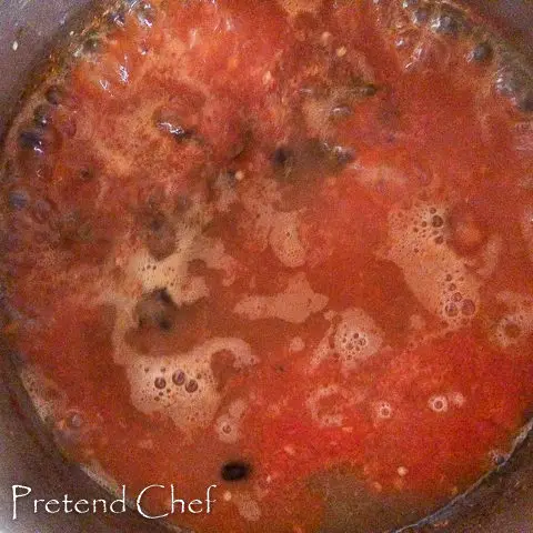 boiling down pepper mix for red ofada stew