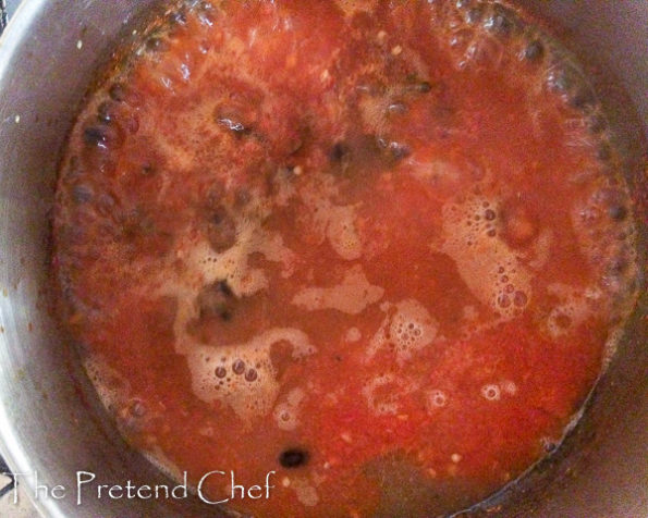 boiling down pepper mix for red ofada stew