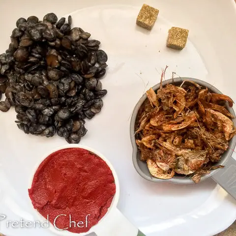 crayfish, iru, tomato paste, seasoning cubes for red ofada stew