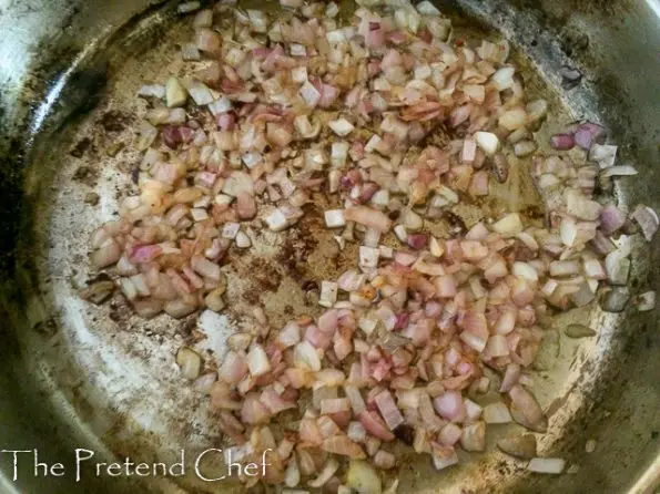 onions frying in a saucepan
