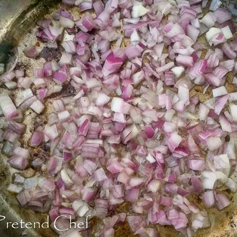 onions frying in a saucepan