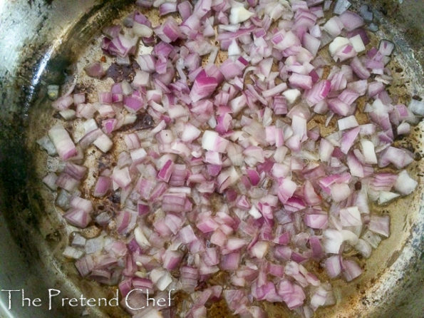 onions frying in a saucepan