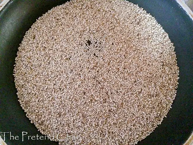 toast sesame seeds in a frying pan