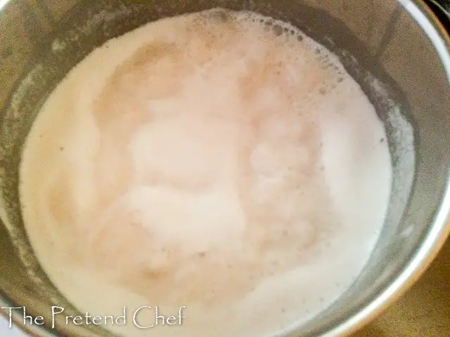 Groundnut milk and rice boiling in a pot