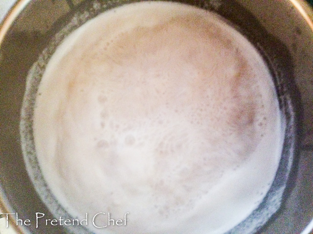 Groundnut milk and rice boiling in a pot