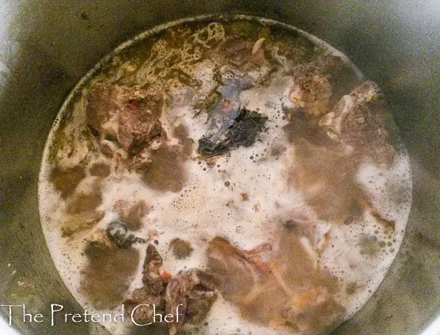 Meat and fish boiling in a pot for Miyan kuka