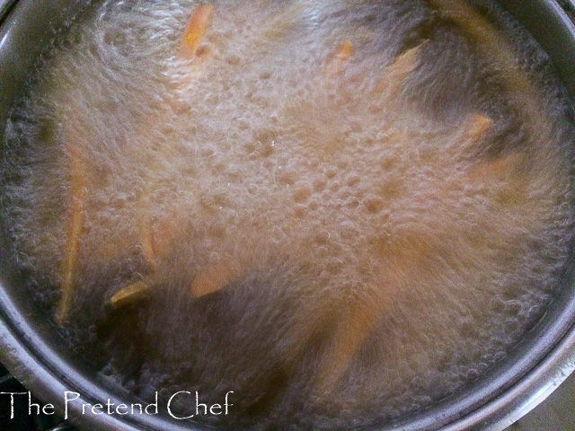 Carrot sticks being fried