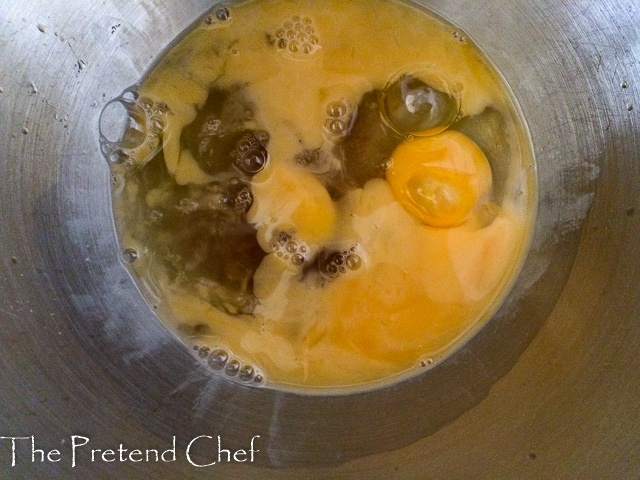 wet ingredients for sweet rice fritters in a bowl