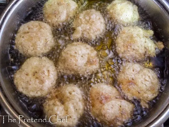 sweet rice fritters frying in a sauce pan