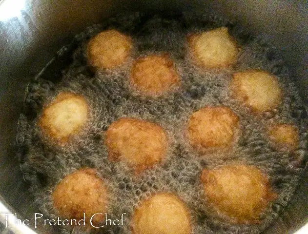 sweet rice fritters frying in a sauce pan