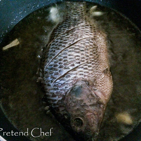 whole fish frying in oil