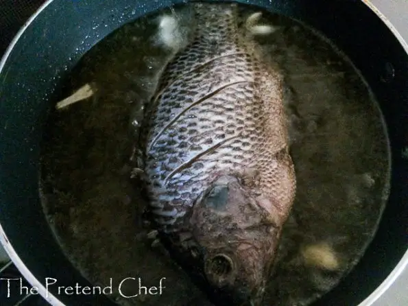 whole fish frying in oil